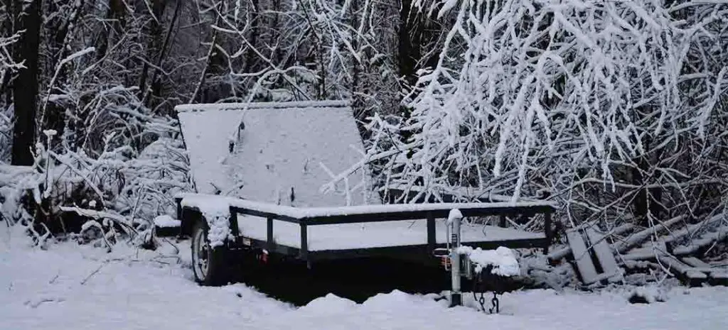 Car trailer under snow