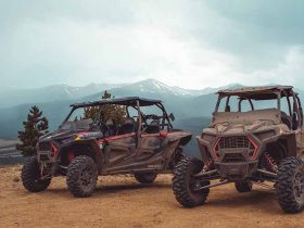 Two dirty Polaris RZR UTVs