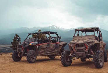 Two dirty Polaris RZR UTVs